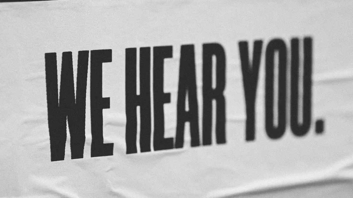 Black and white poster with bold “We Hear You” text representing active listening in customer service experience and brand empathy.