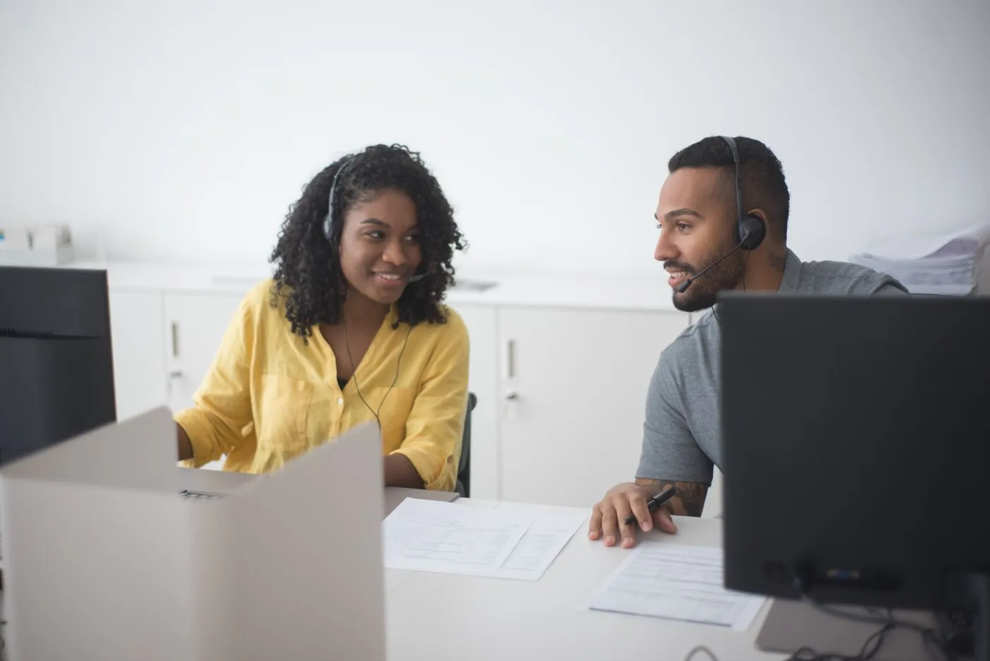 Agents with headsets in a modern office