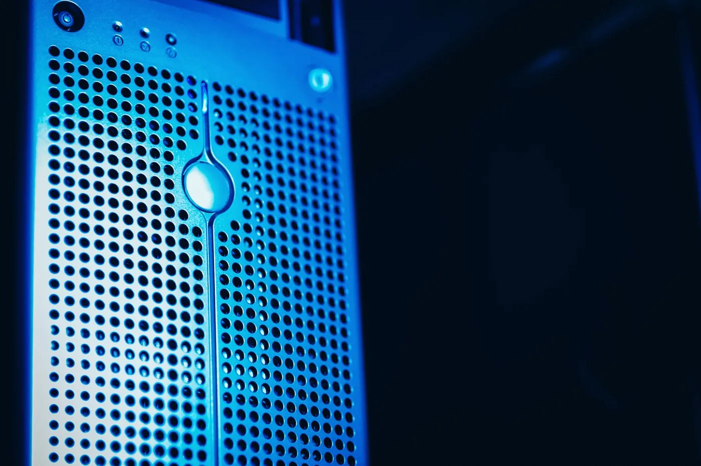 Server rack in a blue-lit data center
