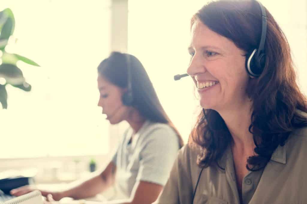 Two native, female German customer service reps provide clear after-sales customer service solutions to a U.S. company that's recently expanded to the German sales market.