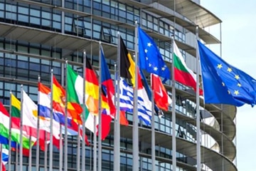 A photo was taken of a building in Europe that has the flags flying of all the European countries - along with the flag for the European union.