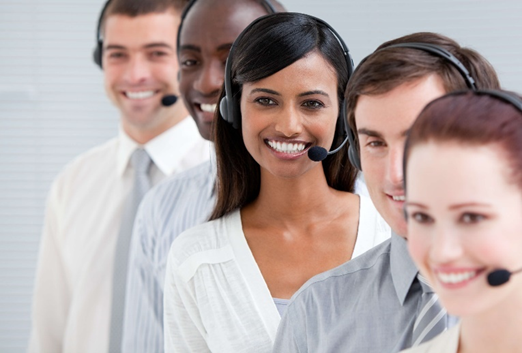 5 customer service agents from various ethnic backgrounds are smiling as they provide superb native language, omnichannel customer service outsourcing solutions to restaurants that are looking to expand their service to national regions.