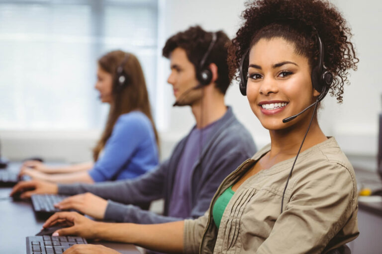 An attractive, smiling customer service rep. from call centers Central America (Jamaica) provides stellar bilingual customer support in English & Spanish to a well-known e-commerce business to improve improve upon their local customer engagement, enhancing their long-term market sales growth & success.