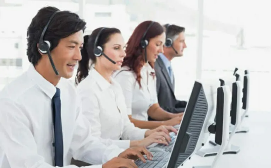 A professional German customer service team handling inquiries efficiently, emphasizing the importance of multilingual support for businesses in Germany.